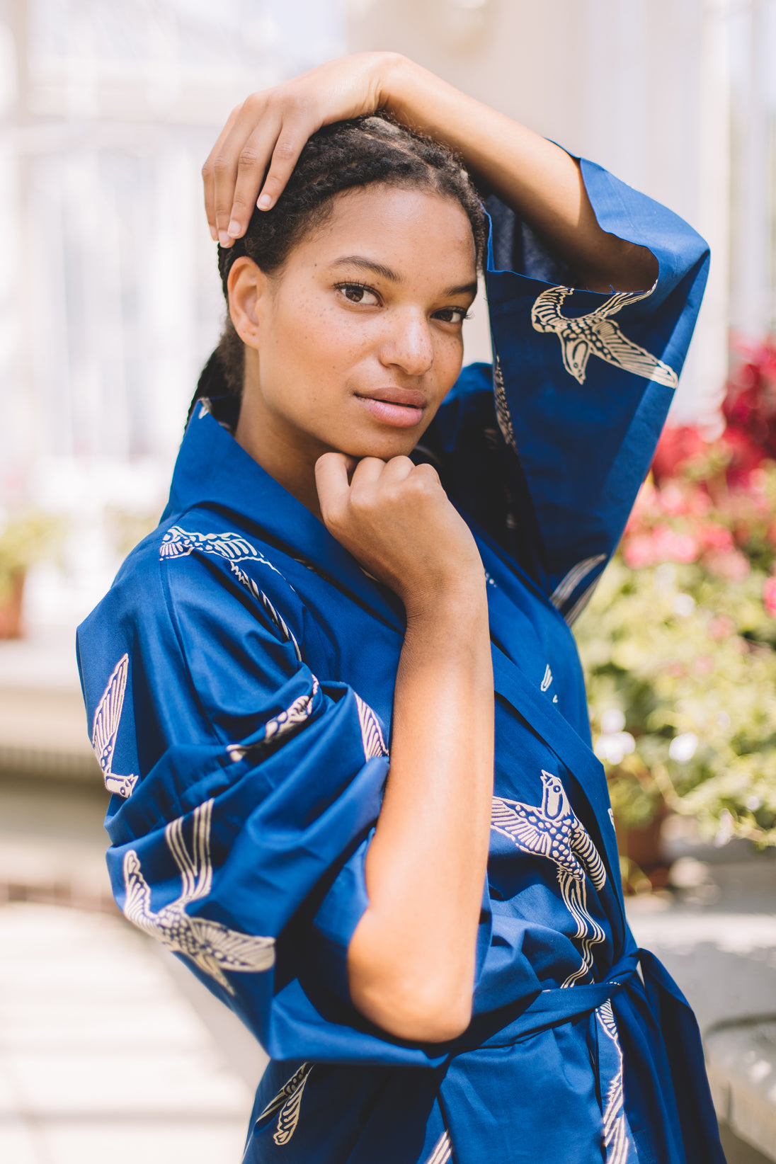 Close-up portrait showing birds on sleeve